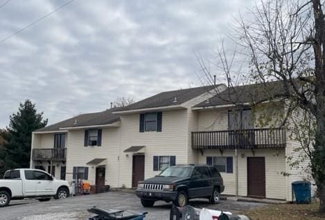 view of front of house featuring a balcony