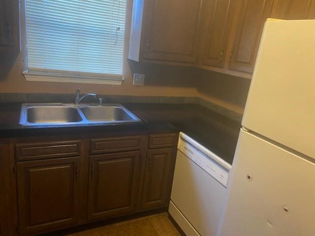 kitchen with white appliances and sink