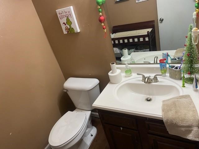 bathroom with toilet and vanity