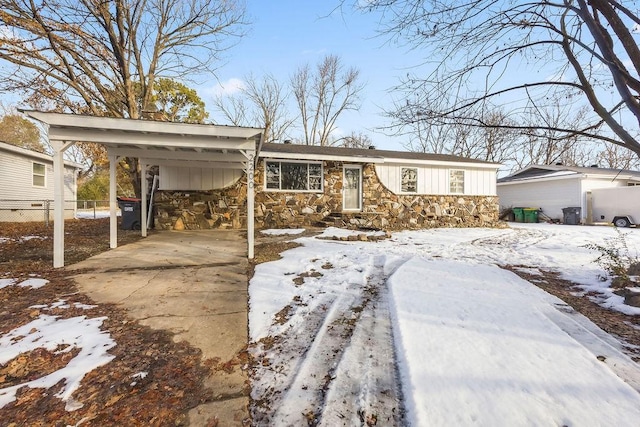 ranch-style house featuring a carport