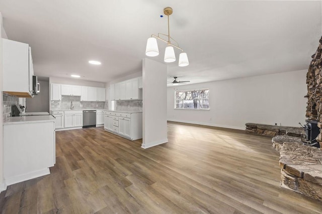 kitchen featuring appliances with stainless steel finishes, ceiling fan, decorative backsplash, sink, and white cabinetry