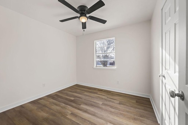 spare room with ceiling fan and hardwood / wood-style floors