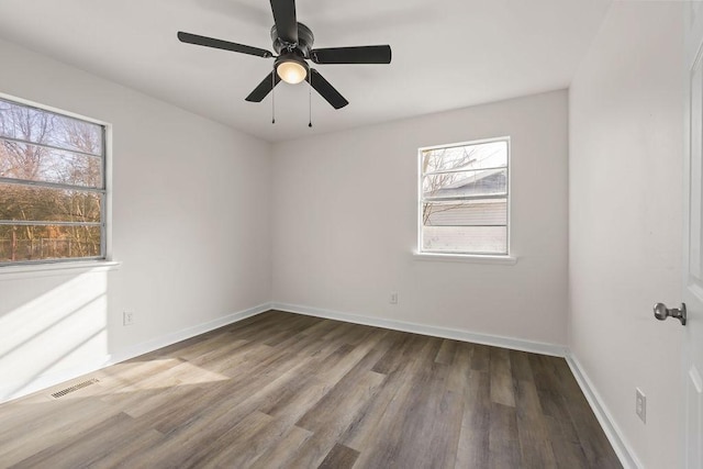 spare room with ceiling fan and wood-type flooring