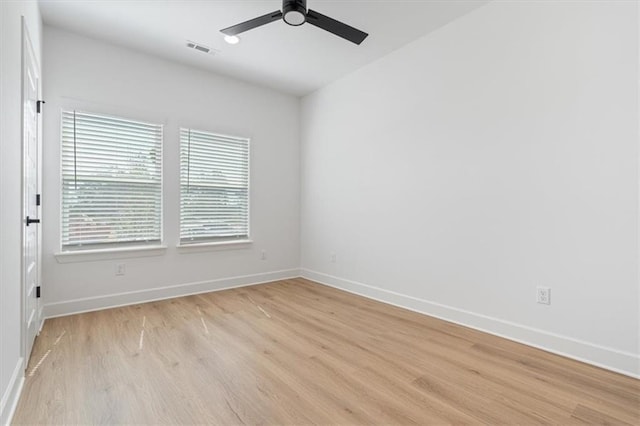 unfurnished room with ceiling fan and light hardwood / wood-style flooring