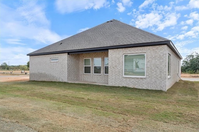 view of side of property featuring a yard