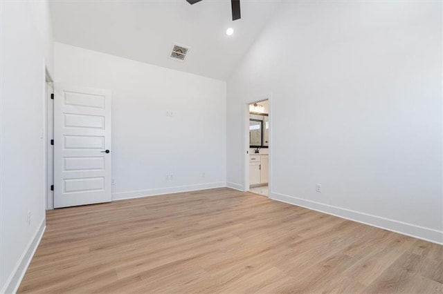 spare room featuring high vaulted ceiling, ceiling fan, and light hardwood / wood-style floors