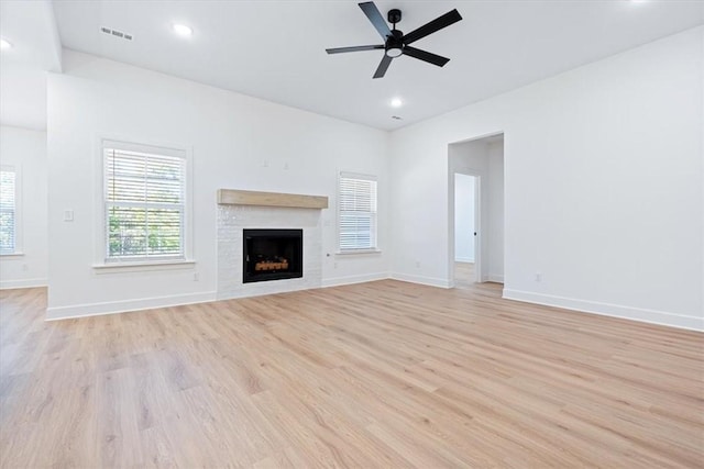 unfurnished living room with ceiling fan and light wood-type flooring