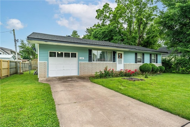 ranch-style home with a front yard and a garage