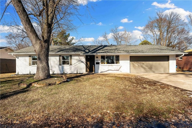 single story home with a front yard and a garage