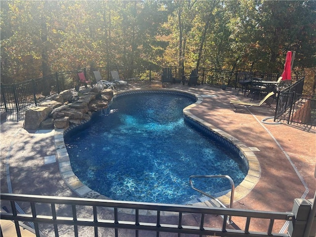 view of swimming pool featuring a patio area