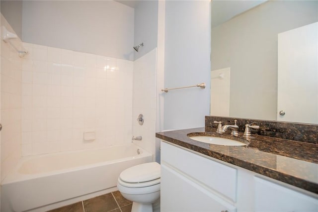 full bathroom with toilet, vanity, tile patterned floors, and bathing tub / shower combination