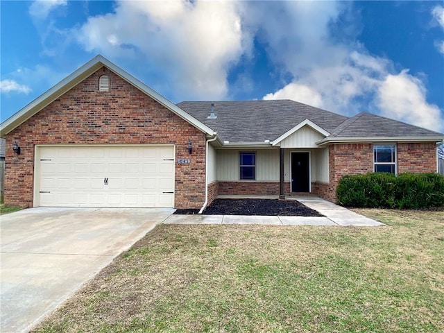 single story home with a front yard and a garage