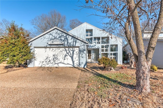2314 E Polk Dr, Fayetteville, AR 72703 - view of front of property featuring a balcony, driveway, and an attached garage