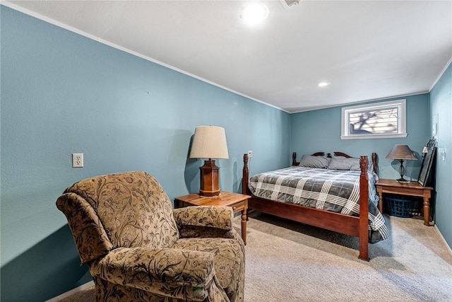 carpeted bedroom with ornamental molding