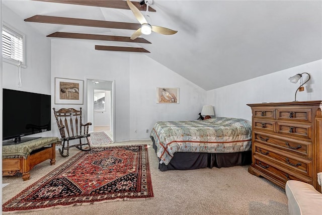 carpeted bedroom featuring ceiling fan, connected bathroom, and lofted ceiling with beams