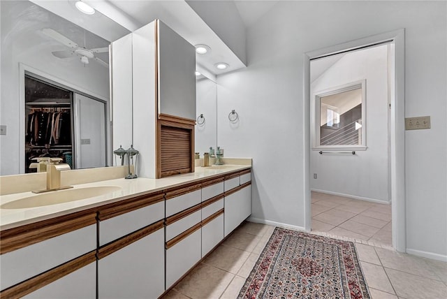 bathroom featuring ceiling fan, tile patterned flooring, and vanity