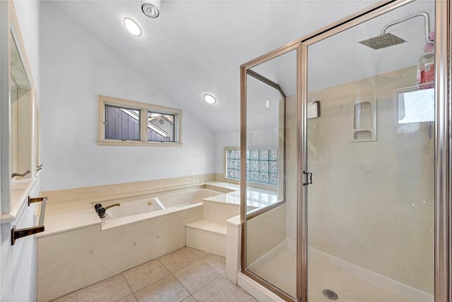 bathroom featuring tile patterned flooring, independent shower and bath, and vaulted ceiling