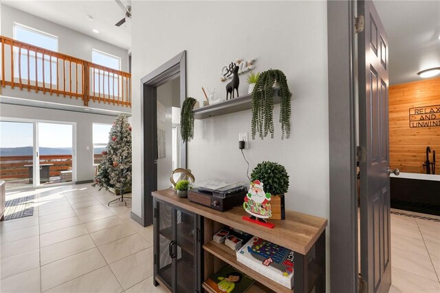 510 Chisholm Trl, Forsyth, MO 65653 - hallway with light tile patterned floors and wood walls