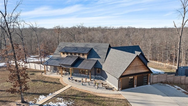 view of front of home featuring covered porch and a garage