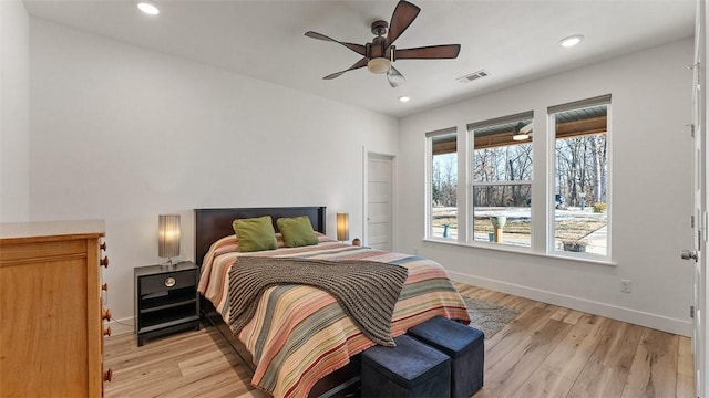 bedroom featuring ceiling fan and light wood-type flooring