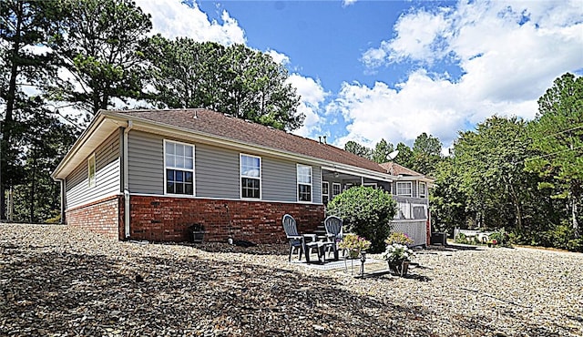 back of house featuring a patio area