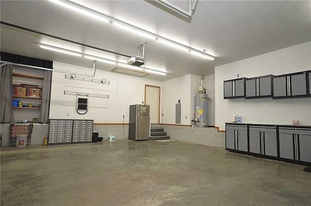 garage with a garage door opener, gas water heater, and stainless steel refrigerator