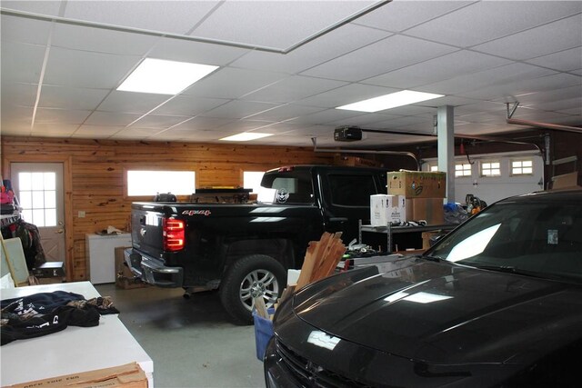 7 Viewpoint Dr, Eureka Springs, AR 72631 - garage featuring wooden walls and a garage door opener
