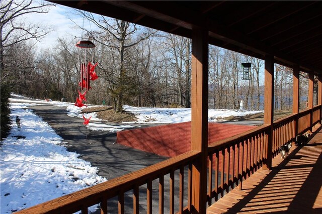 7 Viewpoint Dr, Eureka Springs, AR 72631 - snow covered deck with view of scattered trees