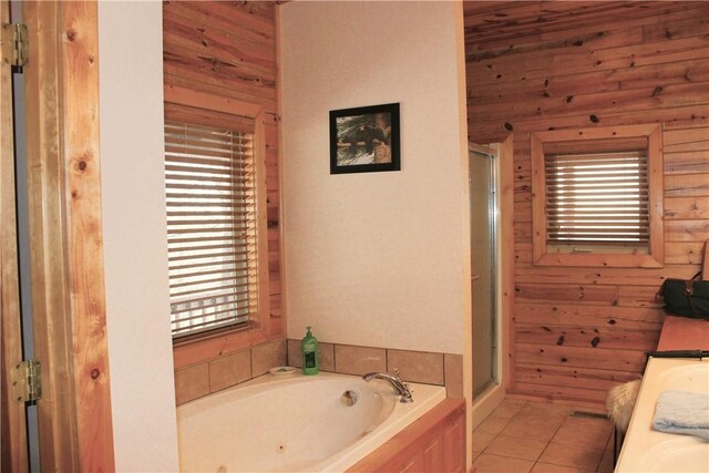 7 Viewpoint Dr, Eureka Springs, AR 72631 - full bathroom featuring healthy amount of natural light, a stall shower, a garden tub, and tile patterned floors