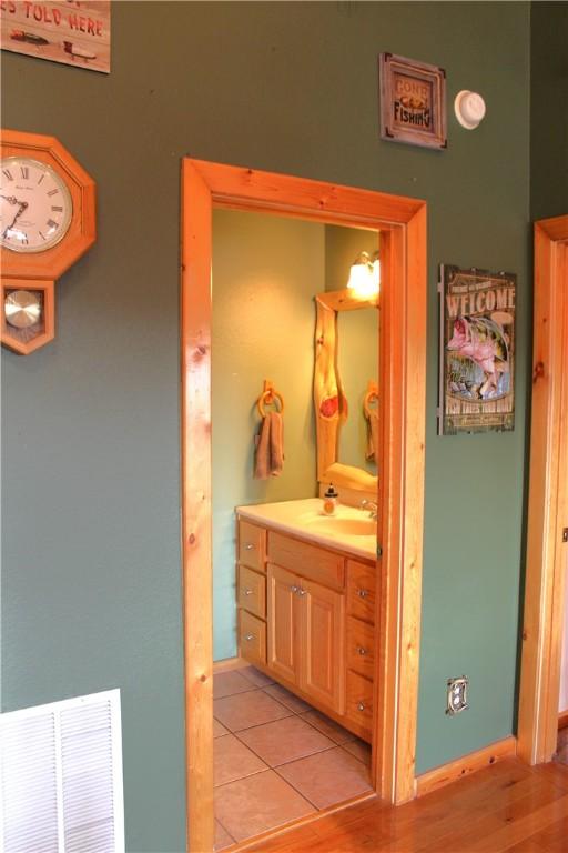 7 Viewpoint Dr, Eureka Springs, AR 72631 - bathroom with vanity and tile patterned floors