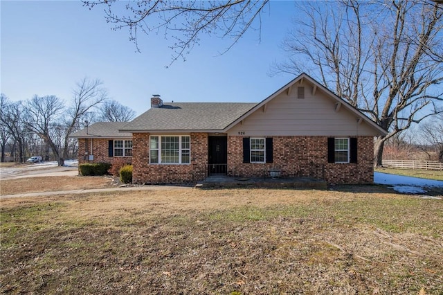 ranch-style home with a front lawn