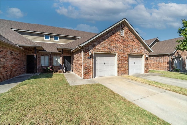 view of front facade with a front lawn and a garage