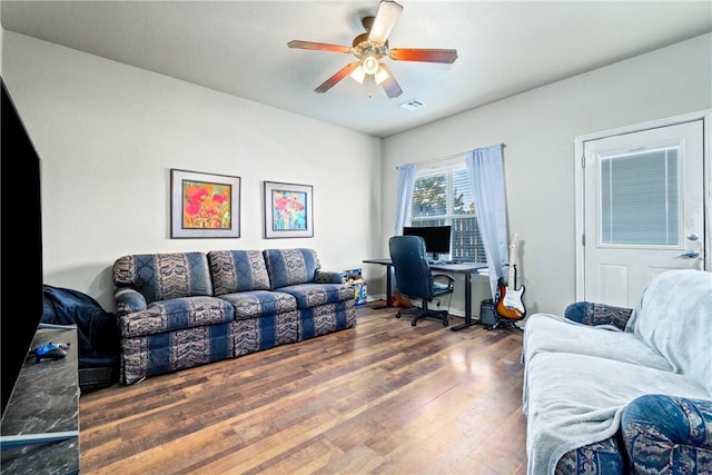 office with ceiling fan and dark wood-type flooring