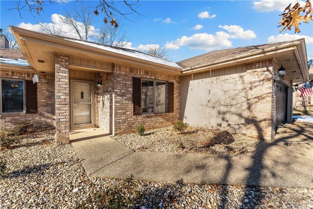 doorway to property featuring a garage