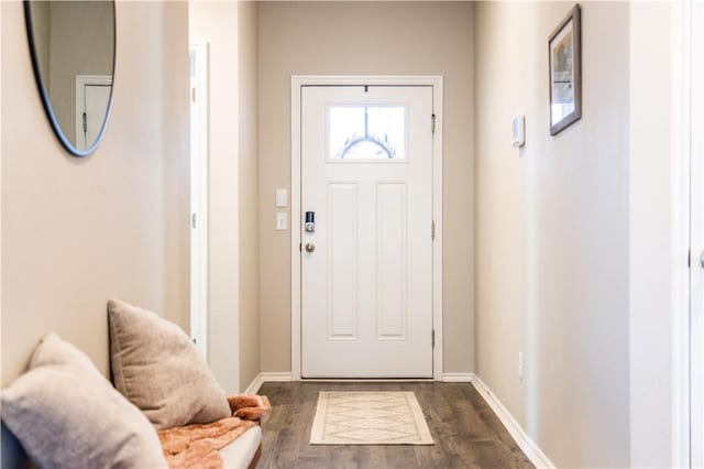 doorway to outside with dark hardwood / wood-style floors