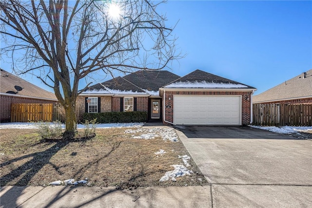 single story home featuring a garage