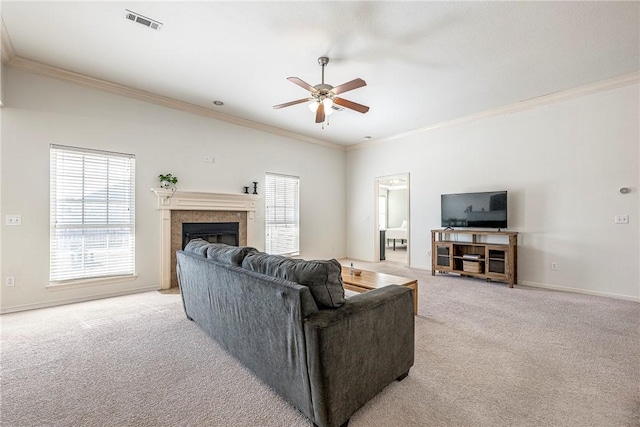 living room with ceiling fan, light carpet, and crown molding