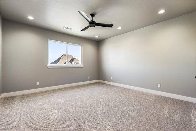 unfurnished room featuring carpet and ceiling fan