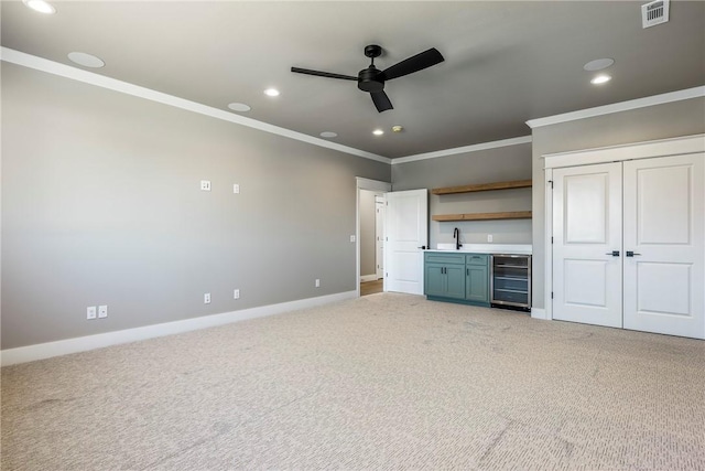 unfurnished bedroom with ceiling fan, light colored carpet, and wine cooler