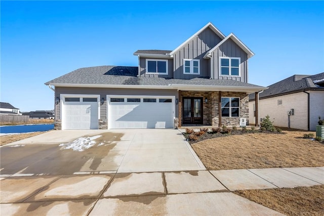 view of front of property with a garage and cooling unit