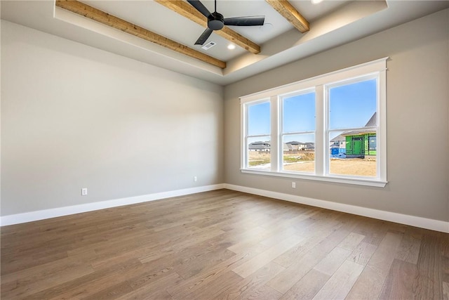 empty room with ceiling fan and hardwood / wood-style floors