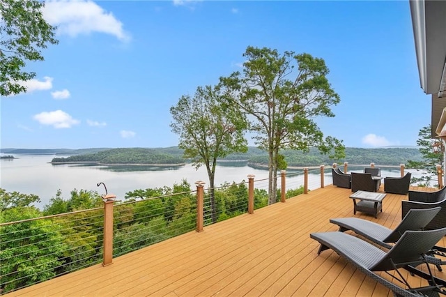 wooden deck featuring a water view