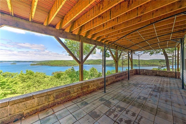 view of patio with a water view