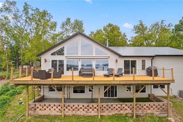 rear view of property with a deck