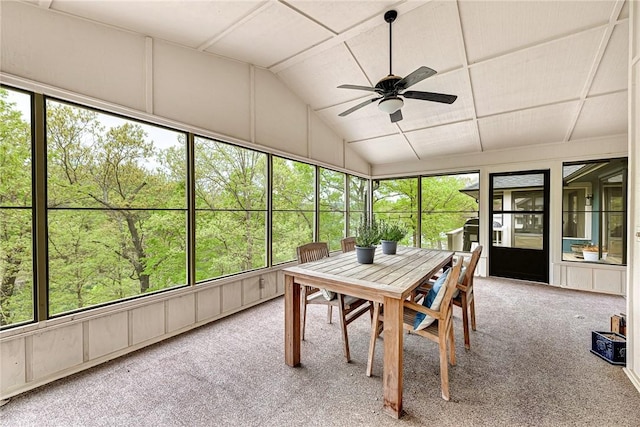 sunroom / solarium with a healthy amount of sunlight, vaulted ceiling, and ceiling fan