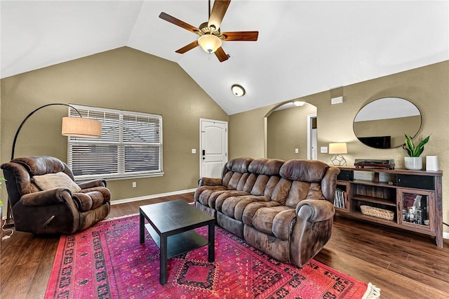 living room featuring ceiling fan, dark wood-type flooring, and vaulted ceiling