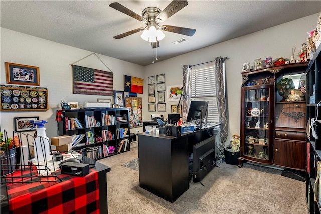 office featuring ceiling fan, a textured ceiling, and carpet flooring