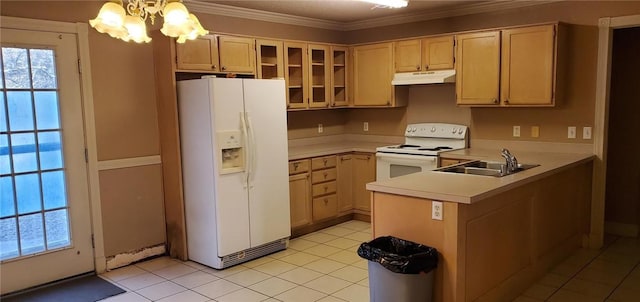 kitchen featuring light brown cabinetry, sink, white appliances, and pendant lighting