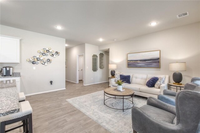 1412 NW 5th Ave, Highfill, AR 72734 - living area with light wood-style flooring, recessed lighting, visible vents, and baseboards