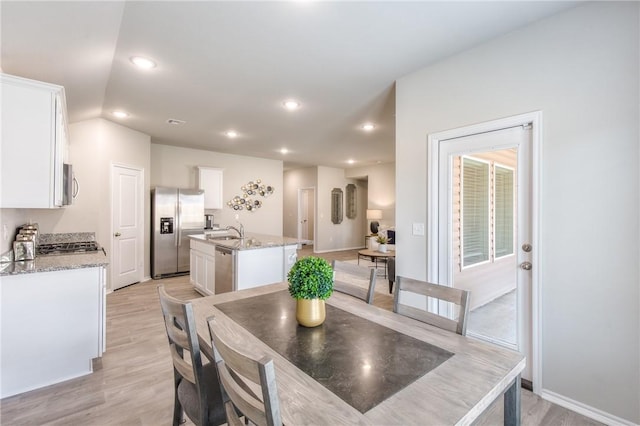 1412 NW 5th Ave, Highfill, AR 72734 - dining space featuring light wood-style floors, recessed lighting, visible vents, and baseboards